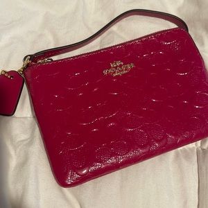 Pink coach wristlet